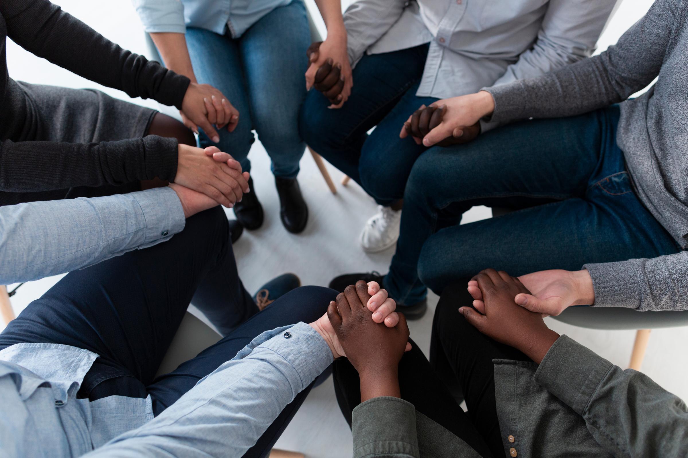 Participants gathered in a circle at a transformation session